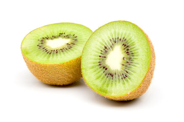 Fresh green kiwi fruit cut in half, placed on a white background.