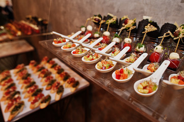 Dessert table of delicious snacks on wedding reception.