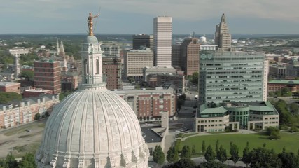 Aerial of statue on top of the  Rhode Island State House Capitol building, Providence, Rhode Island, USA. 27 August 2019
