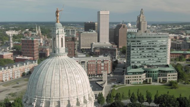 Aerial of statue on top of the  Rhode Island State House Capitol building, Providence, Rhode Island, USA. 27 August 2019