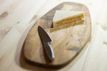 a slice of sandwich and sharp knife