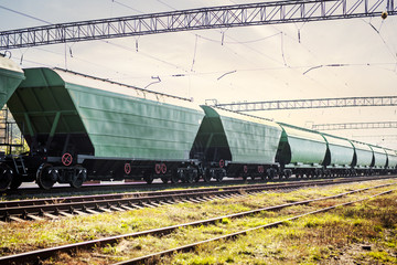 Fototapeta na wymiar green train cars are on colony