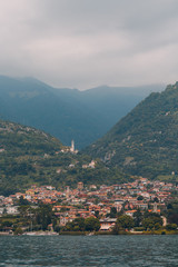 Fototapeta na wymiar Little Italian town on coast Lake Como, Italy