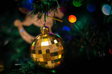 golden christmas ball on tree