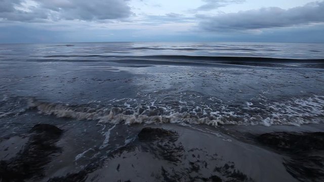 Cinematic view of the waves on the beach of Beddingestrand in Sweden	