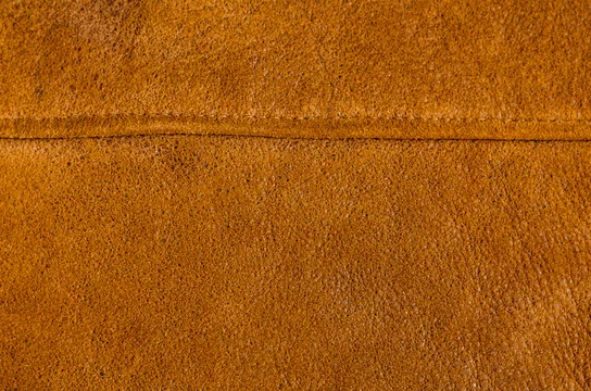 Brown leather with a seam. A fragment of unpolished leather with a textile  seam. Suede structure with residues of protective impregnation. Leather  craft. Stock Photo | Adobe Stock