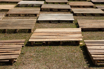 wooden blocks neatly arranged on the grass, selectively focused