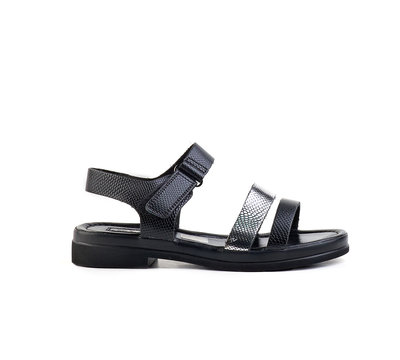 black and silver shiny female summer sandals on a white background isolate.