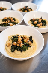 Bowls with chickpea hummus and kale