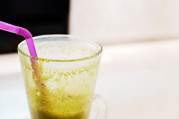 half-drinked maccha iced latte