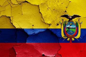 flags of Colombia and Ecuador painted on cracked wall