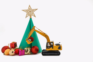 Christmas ornament and Excavator model , Holiday celebration concept new year on white background