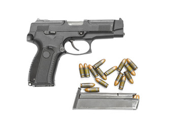 isolated combat black pistol with cartridges on a white background