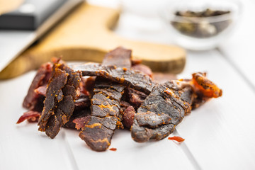 Beef jerky pieces. Dried beef meat.