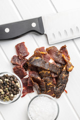 Beef jerky pieces. Dried beef meat.