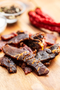 Beef jerky pieces. Dried beef meat.