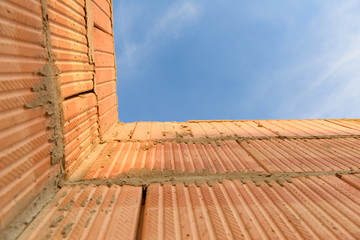 Interior of a Unfinished Red Brick House Walls under Construction without Roofing