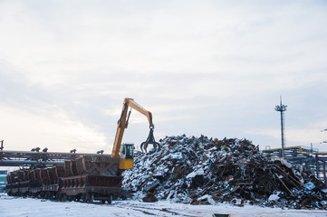 Crane-loading scrap in a train