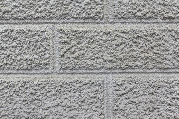 putty in the form of tiles, uneven, rough wall of putty, wall decoration