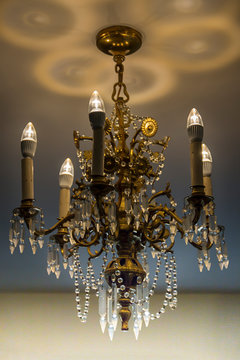 Vintage gold chandelier at a mansion 