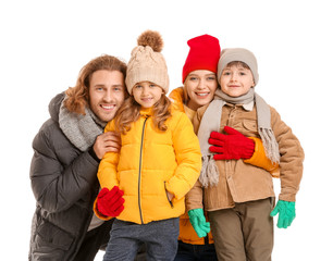 Happy family in winter clothes on white background