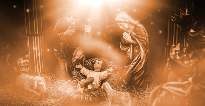 The statue of Mary Joseph and Jesus, Jesus' birthday baby is a statue of Maria and Joseph and Jesus, a newborn baby. There is a beautiful aura light on the hay. Christmas nativity scene