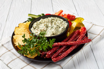 Creamy spinach dip in a black bowl