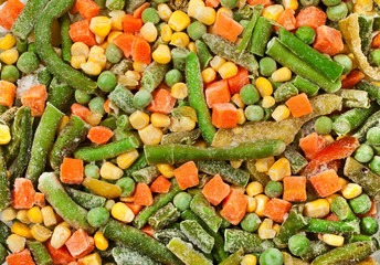 Frozen vegetables (carrot, beans, pea, corn), background. Top view.