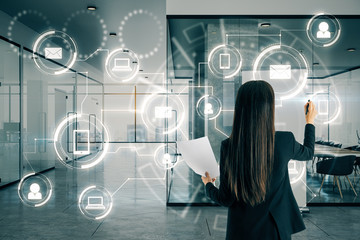 Businesswoman drawing digital business interface