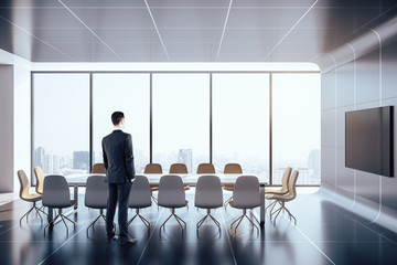 Businessman standing in meeting room