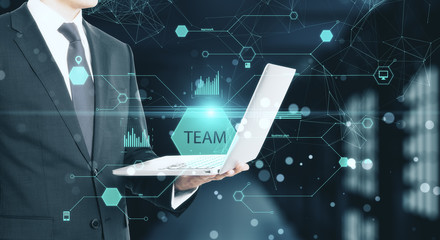 Businessmen holding laptop