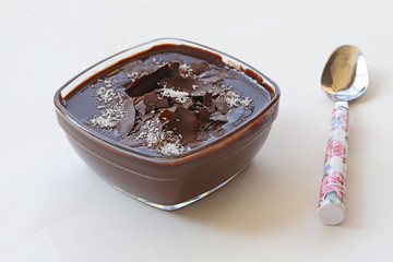 Supangle (pudding) dessert in glass bowl, on white background.