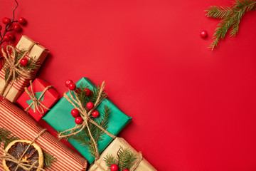 Chistmas red festive background with natural paper gifts