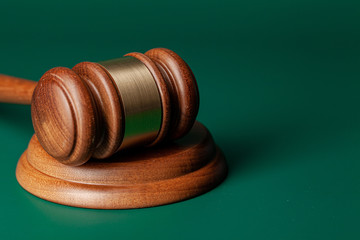 Wooden judges gavel on table close up