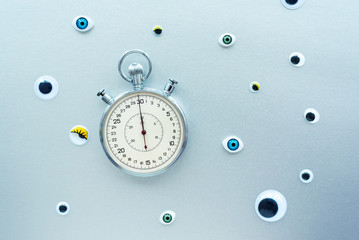 Abstract composition with stopwatch and eyes. Create conceptual with Time, Deadlines, Stress, Aging