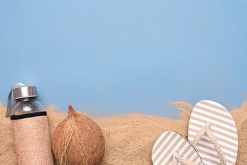 Coconut cocktail on the beach sand background with copy space.