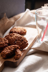 Chocolate crispy cookies with glass of milk close up