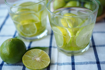 Sliced lemon and lemon juice soaked in a glass