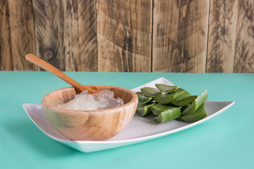 Fresh Aloe vera in bamboo bowl