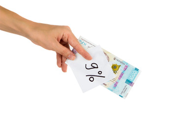 Thousand hryvnias and sticker with different financial signs and symbols in the hand, isolated