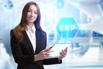 Business, Technology, Internet and network concept. Young businessman working on a virtual screen of the future and sees the inscription: ERP