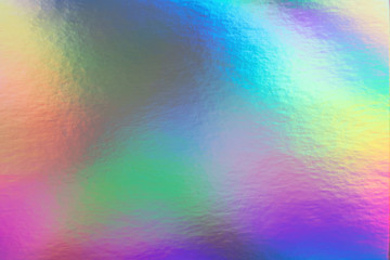 Abstract trendy rainbow holographic background in 80s style. Blurred texture in violet, pink and...