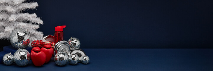 Sports equipment and  Christmas ornaments. Fitness New Year and Christmas background