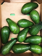 Delicious fresh avocado on the market view