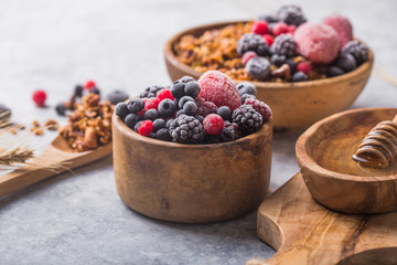 Morning  Granola, Fruits, Berries in bowl on grey concrete background. Healthy breakfast cereals. Concept of dieting, healthy  clean eating