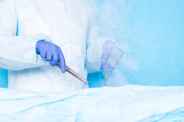 Dr. cryosurgeon performs a modern operation using liquid nitrogen, cryosurgery. Liver and hair...