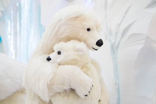Mother and son bears hugging