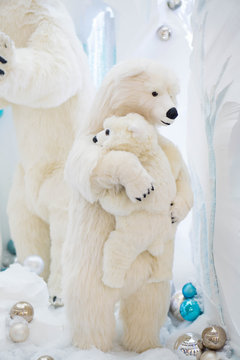 Mother and son bears hugging