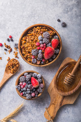 Morning  Granola, Fruits, Berries in bowl on grey concrete background. Healthy breakfast cereals. Concept of dieting, healthy  clean eating