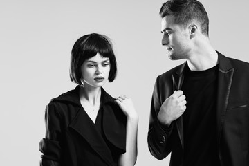 man and woman talking on cell phone